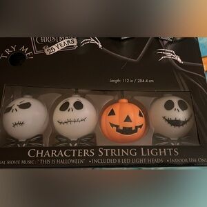 NBC- String Lights & plays theme song- Black, White, and Orange